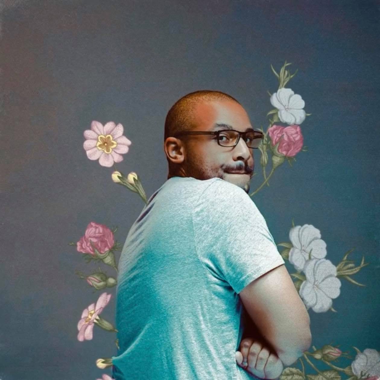 Darrin Smith looking over his shoulder, surrounded by flowers